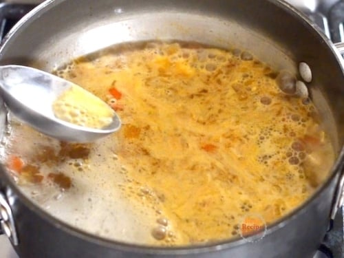 Skimming the simmering soup
