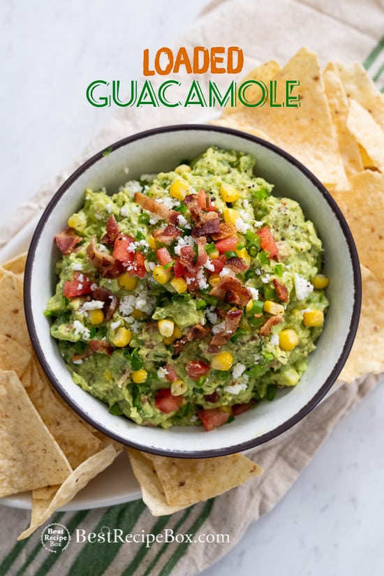 Best Loaded Guacamole Recipe with Bacon in a bowl with chips