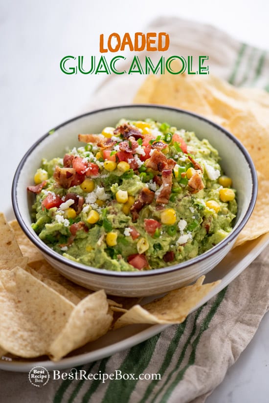 Best Loaded Guacamole Recipe with Bacon in a bowl with chips