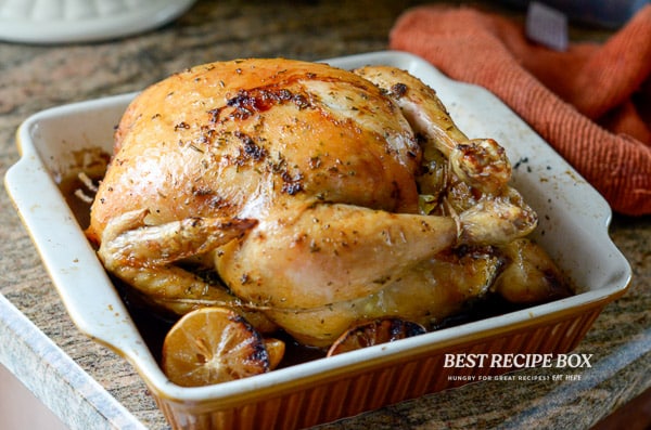 Roasted whole chicken in baking dish