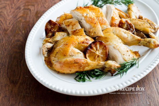 Whole chicken cut up into pieces in baking dish