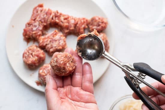 Using a cookie scoop to form meatballs