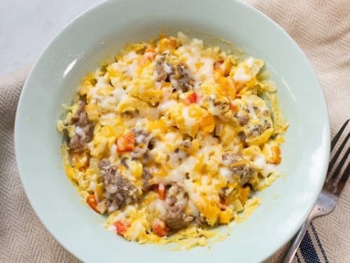 Cheese melted on top of sausage scramble