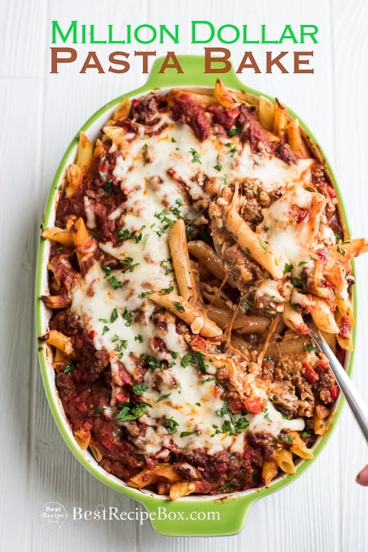 Million Dollar Pasta Bake Recipe with Cheesy Meat Sauce in casserole with spoon