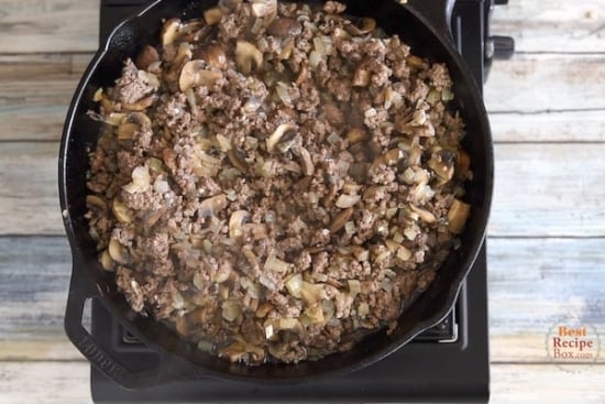 Browned beef and mushrooms in skillet