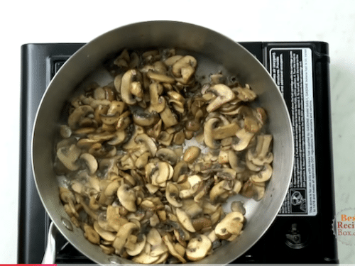 Mushrooms cooking in pan