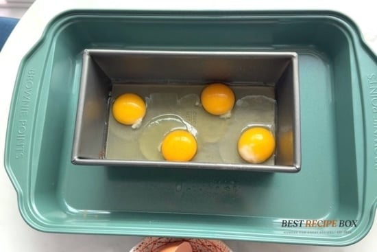 Eggs cracked into loaf pan