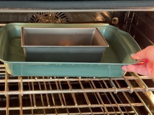 Placing pans into oven