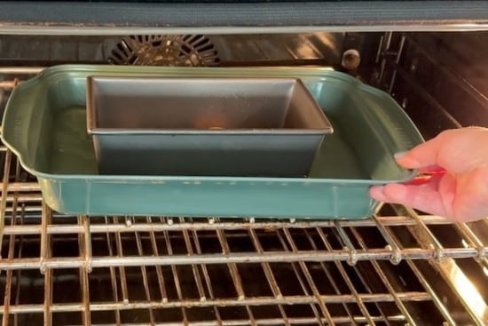 Placing pans into oven
