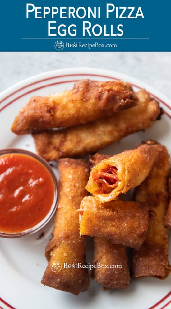 Plate of egg rolls filled with pepperoni pizza toppings on a plate