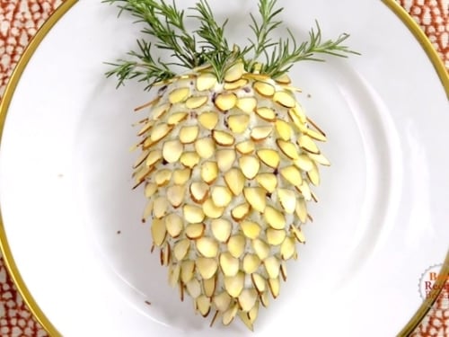 Finished pinecone cheese ball on a plate