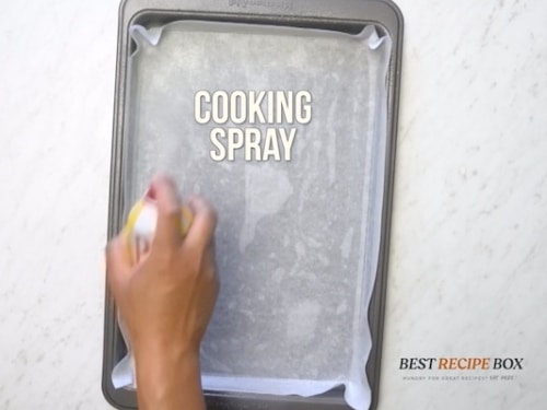 Spraying pan with cooking spray