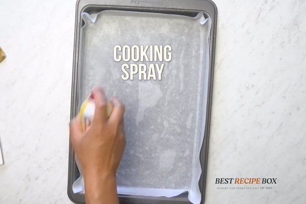 Spraying pan with cooking spray