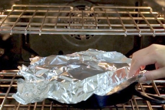 Skillet covered with foil in oven