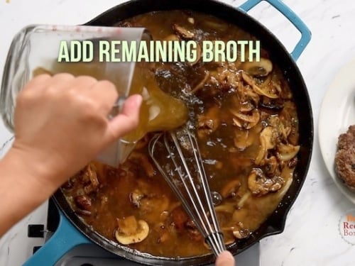 Pouring in remaining broth to the mushrooms and onions