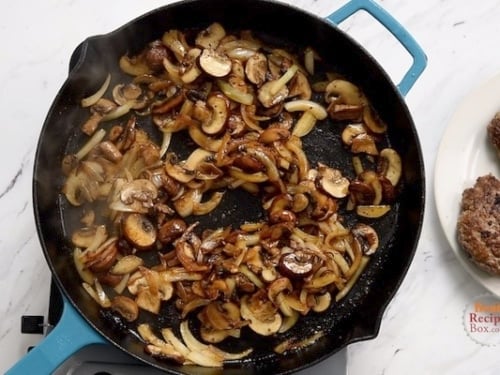 Mushrooms and onions browned in a skillet
