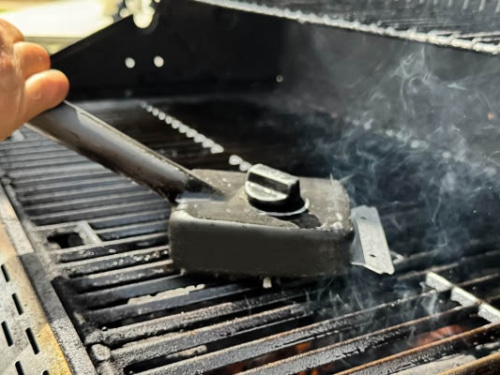 scraping grill for pre-heating