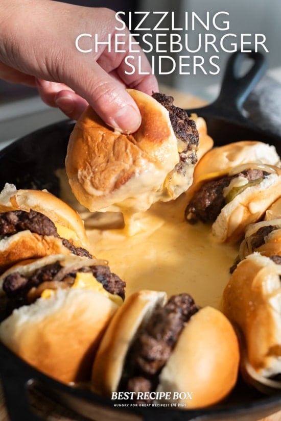 holding slider in hot cheese sauce