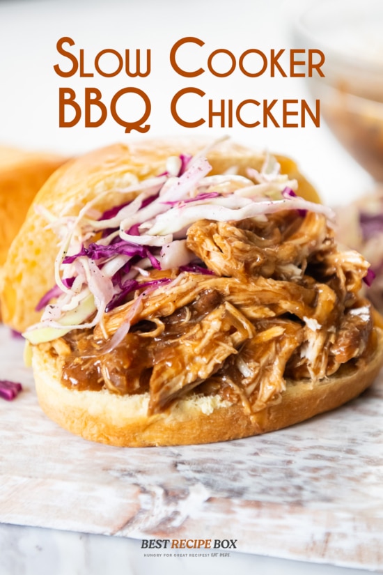 slow cooker bbq chicken sandwich with slaw on top 
