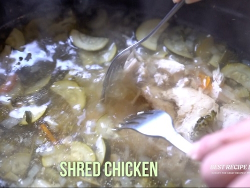 Shredding chicken in slow cooker with 2 forks