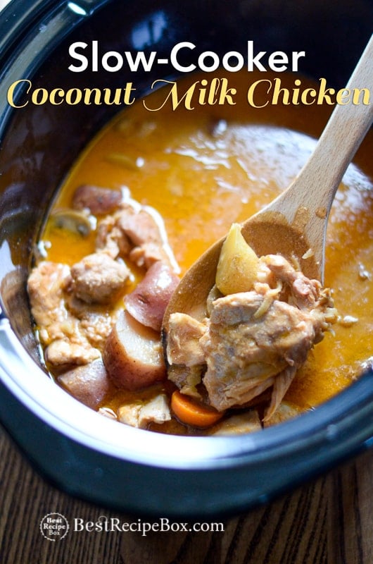 Slow Cooker Coconut Milk Chicken Recipe in a cooking pot with a wooden spoon crock pot curry chicken