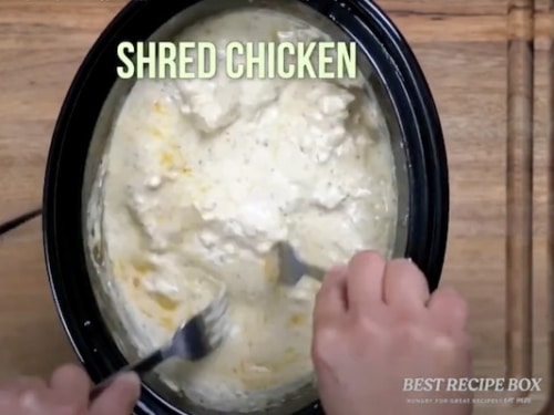 Shredding the slow cooked chicken