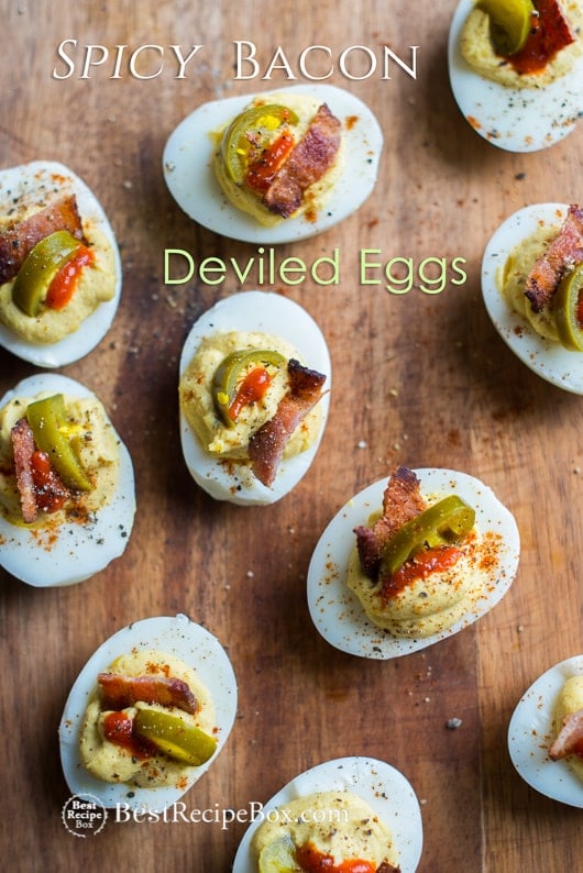 Deviled Eggs Recipe with Bacon, Sriracha, Jalapeño Spicy Deviled Eggs on a cutting board