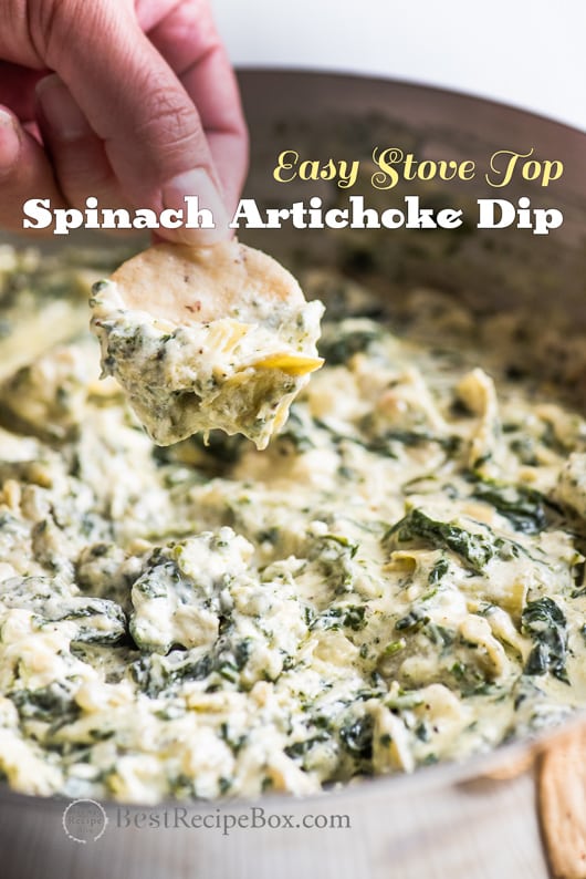Stove Top Spinach Artichoke Dip Recipe in bowl with crackers 