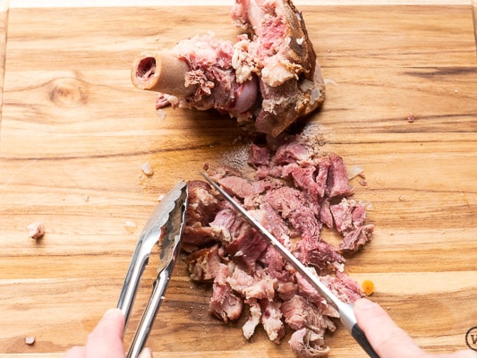 Chopping up ham from ham bone