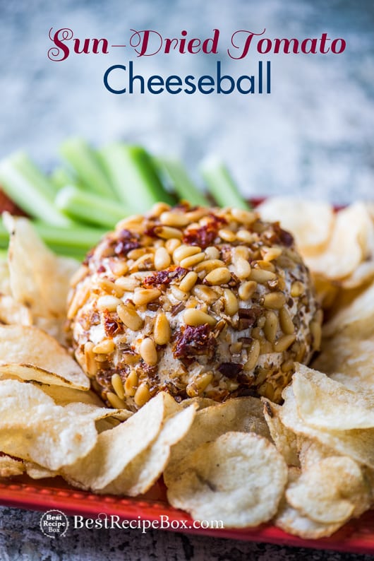 Sun Dried Tomato Cheese Ball Recipe on a plate with chips and celery