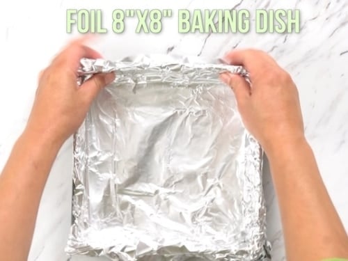 Putting foil in baking pan