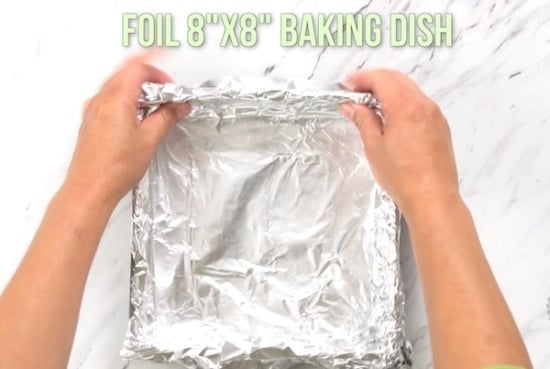 Putting foil in baking pan