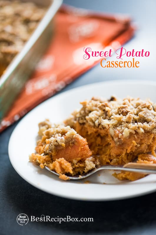 Sweet Potato Casserole Recipe with Crunchy Nut Topping on a plate with spoon