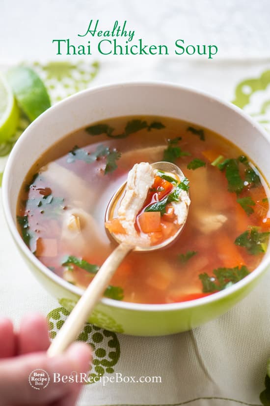Thai Hot & Sour Chicken Soup Recipe in a bowl with spoon 