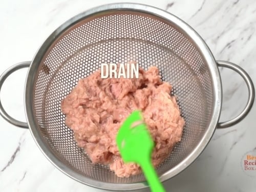 draining tuna for tuna salad
