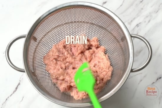 draining tuna for tuna salad