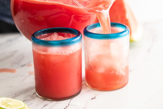 Pouring the watermelon aqua fresca into glasses with ice