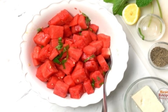 Watermelon chunks stirred into the dressing