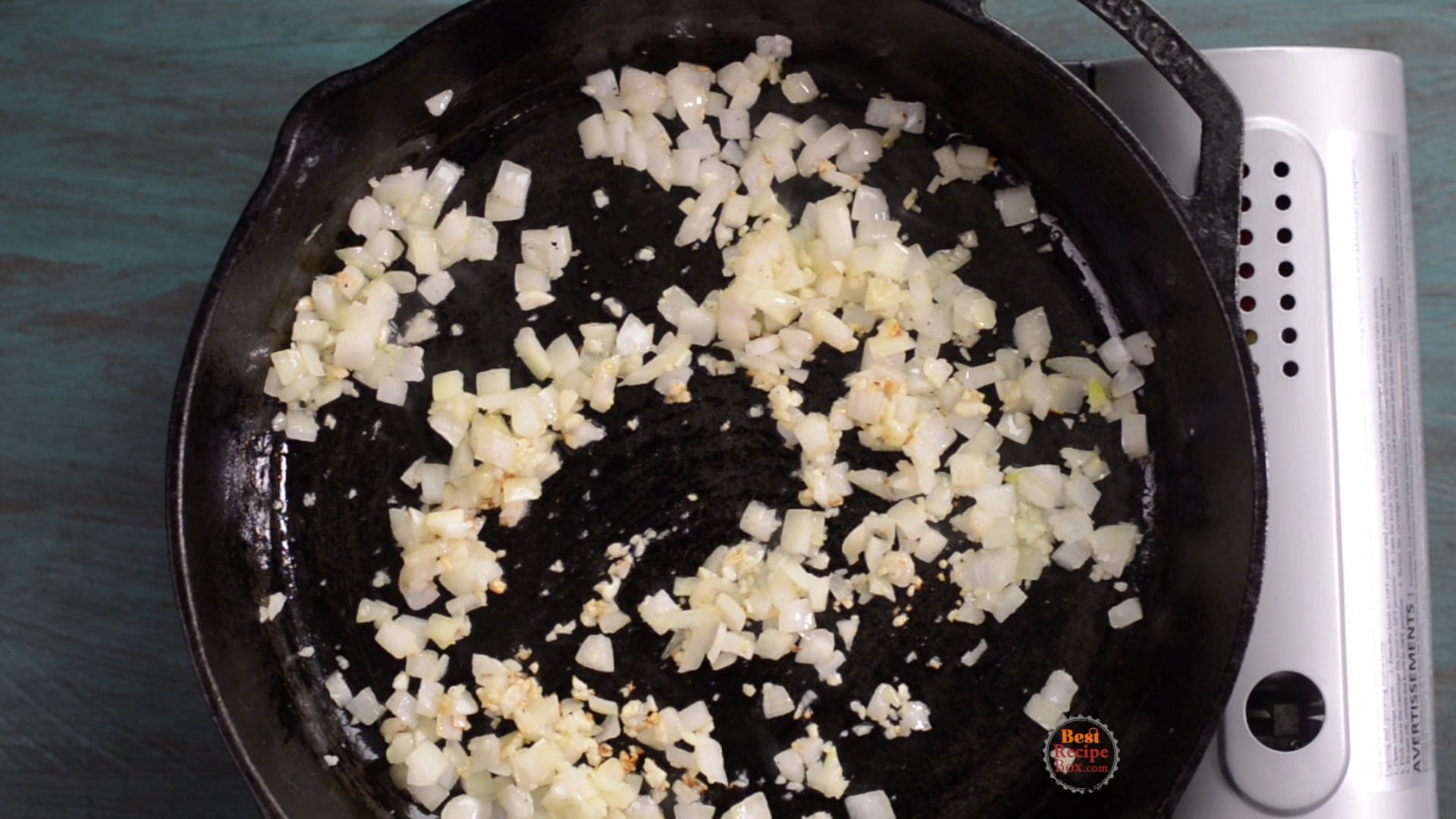 Cooking onions and garlic in a skillet