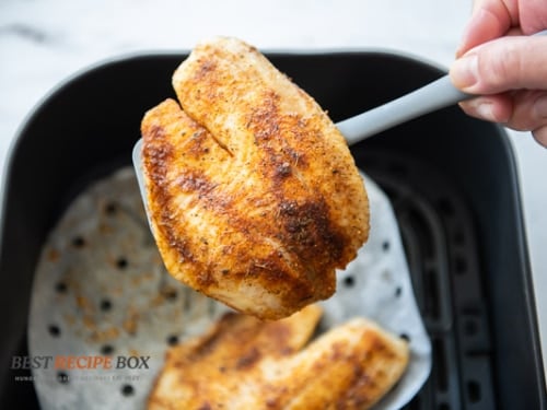 cooked fish fillet on spatula