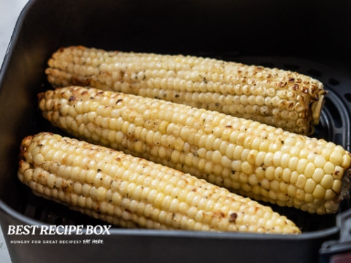 Cooked corn in air fryer basket