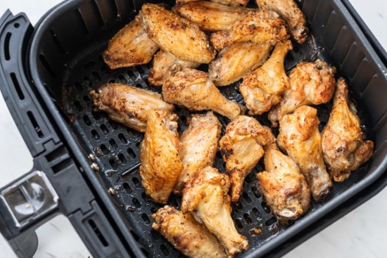 Cooked wings in the air fryer basket