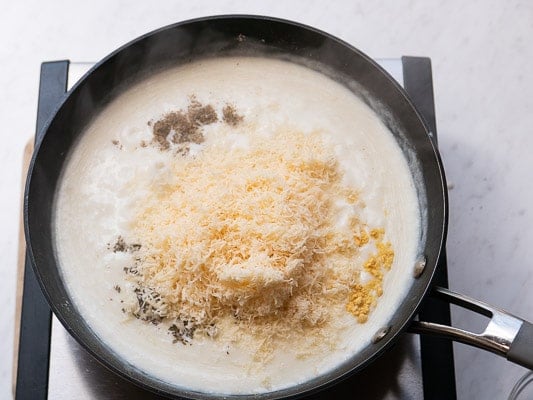 Parmesan and spices added to the sauce