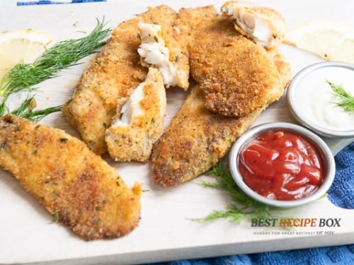 Crispy fish fillets on a plate with sauces
