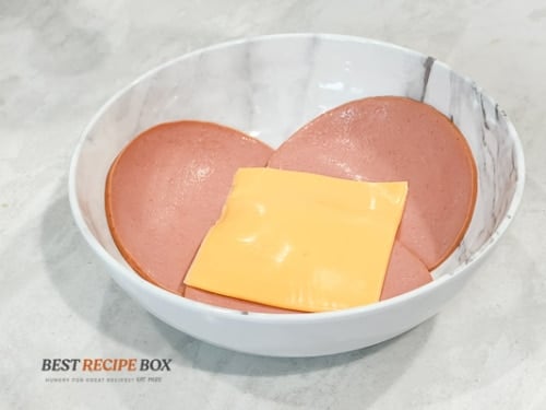 Cheese on bologna in bowl
