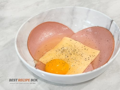 Egg added to bowl