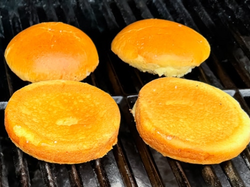 Burger bun toasting on grill