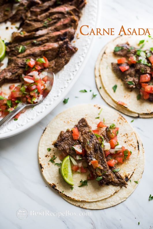 Carne Asada Recipe - Mexican Beef for Tacos, Burritos and more on Cinco de Mayo on a cutting board 