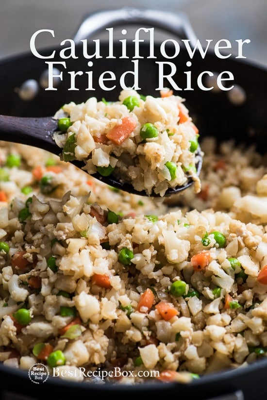 Cauliflower Fried Rice Recipe in cooking pan with wooden spoon