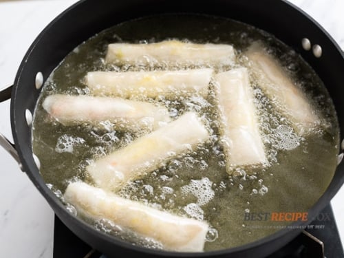 Cooking egg rolls in a hot oil